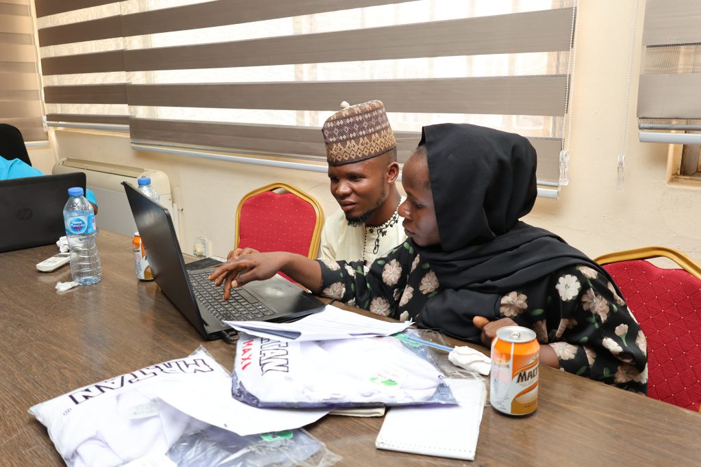 Cowpea breeding technicians performing data entry and quality checks during EBS training. Credit: IITA 