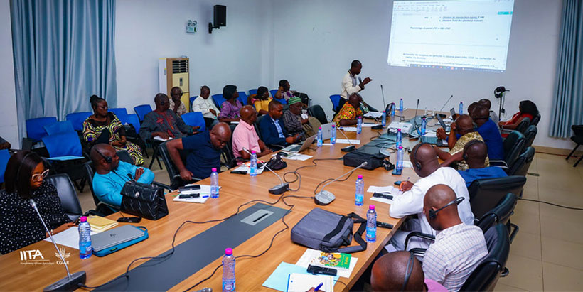 Participants listening to a facilitator during the capacity building session.