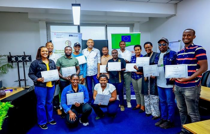 Dr Okike Iheanacho and trainees holding their certificates after the FeedCalculator training.