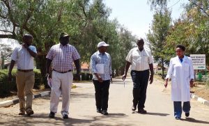 PIcture of DG accompanied by IITA  and KALRO Katumani staff as he tours the center.