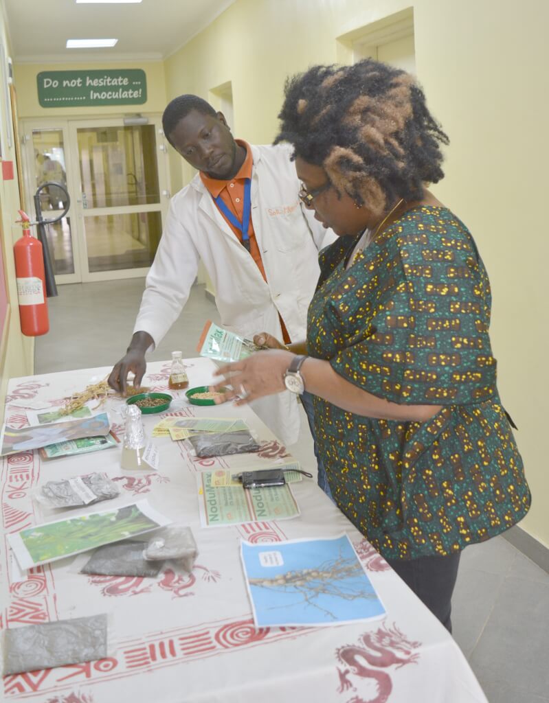 Picture of Ikenze of the Australian High Commission visit the IITA labs.