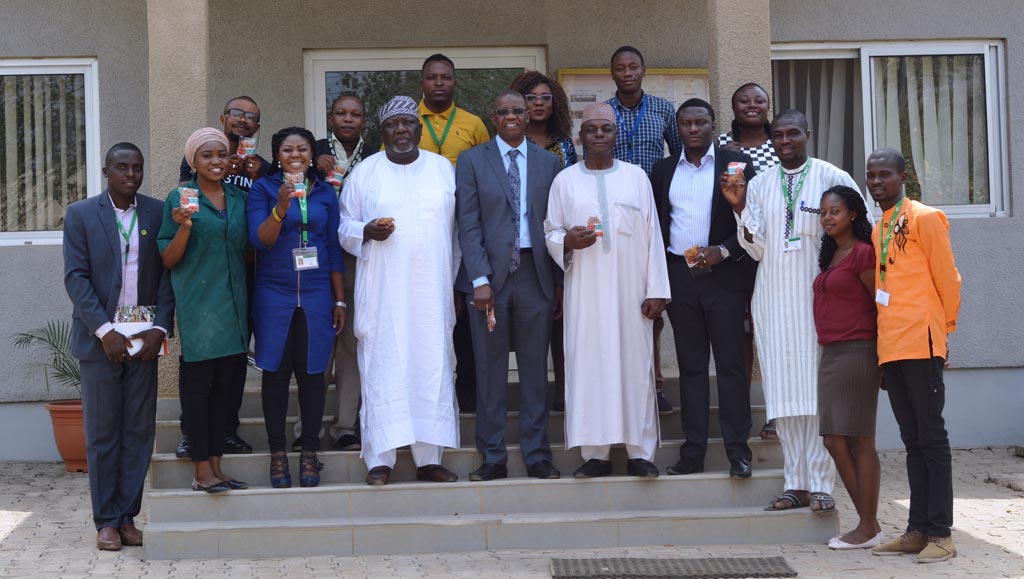 A group photograph of staff of the IITA Abuja station with visiting team