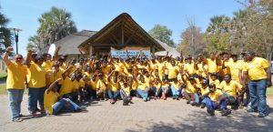 Picture of SARAH! Retreat participants cheering on the Hub during the group photo session.