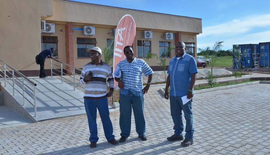 Picture of From left to right: Drs Ntawuruhunga, Chikoye, and Chigeza having a hearty laugh in front of the main science and admin block.