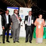Picture of some of the awardees and their plaques.