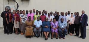 Picture of Climate change actors from government  and nongovernment organizations at the workshop. At center (in blue suit) is the guest of honor, Engr Angelina Madete, Deputy Permanent Secretary at the Vice President’s Office, Tanzania.