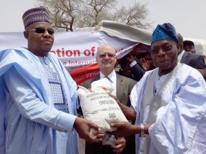 Picture of The Governor of Borno State, Alhaji Kashim Shettima; Deputy Director General, Partnerships for Delivery at IITA, Dr Kenton Dashiell;  and IITA Ambassador  and Former President of Nigeria, Chief Olusegun Obasanjo during the donation of 35,930 kilograms of seeds  and 2640 kilograms of rice to Borno State government today (22 May 2017) in Maiduguri.