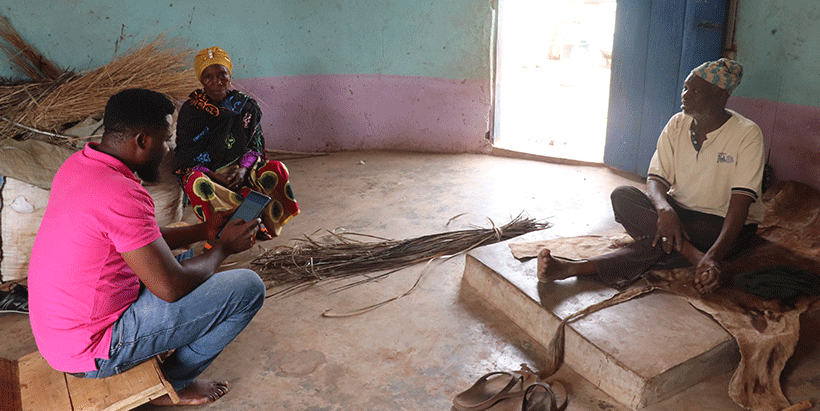 A couple responding to a questionnaire together from an enumerator during the MFS baseline survey in Ghana. 