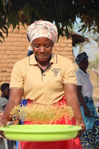 Arlinda Máquina is one of the project beneficiar and she actively participates in the cooking demonstration to learn and teach