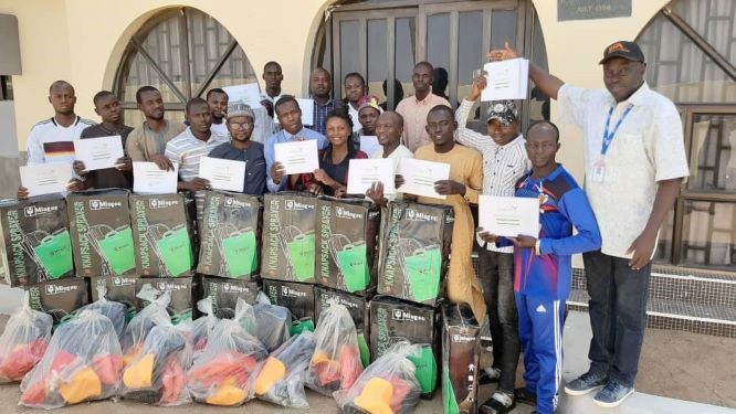 Adamawa State participants with training facilitators behind.