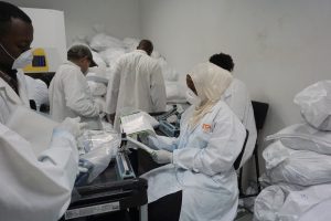 Staff at IITA preparing and packing AflasafeTZ for shipping to A to Z Company.