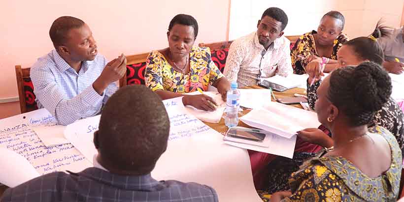 Agricultural extension and community development officers deliberating on how to support women CSEs. Photo: IITA/Hadi Rashid