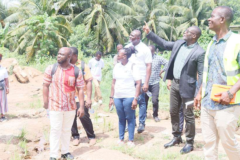 Dr Asare, the engineer, and the contractor touring the lavarium.