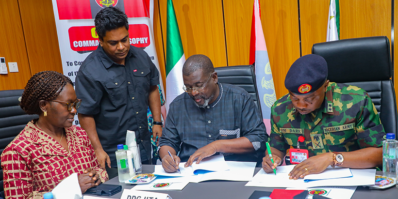 Dr Tahirou Abdoulaye and Major General O. M. Dare signing the Memorandum of Understanding.