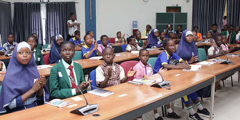 Cross section of school children participating during a quiz session at the Radio IITA's Children Day event.