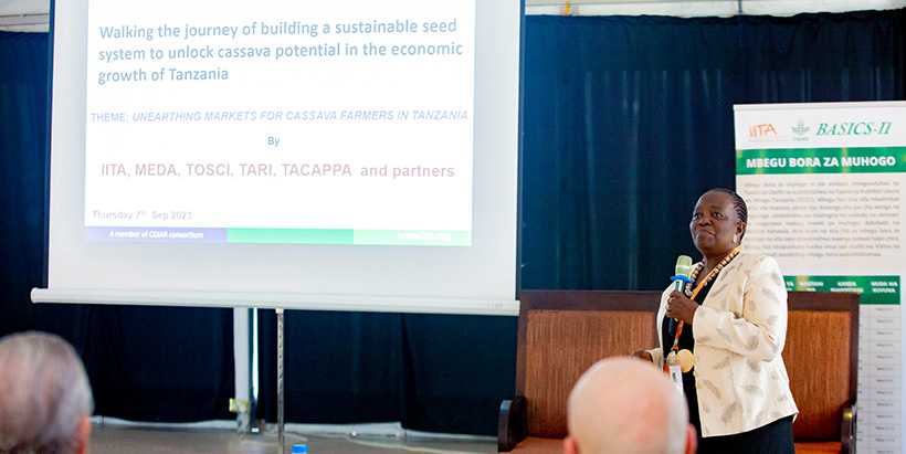 Dr Regina Kapinga, Head, Advocacy, Resource Mobilization, and seed systems specialist explaining about the walking journey of building sustainable seed systems to meeting participants. Photo credit: CGIAR