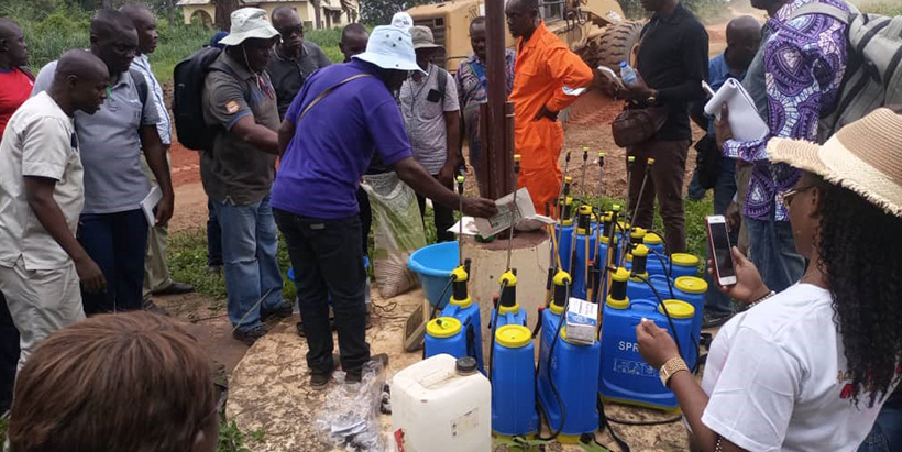 Demonstration on the use of a sprayer by Dr Nanga at IRA station.