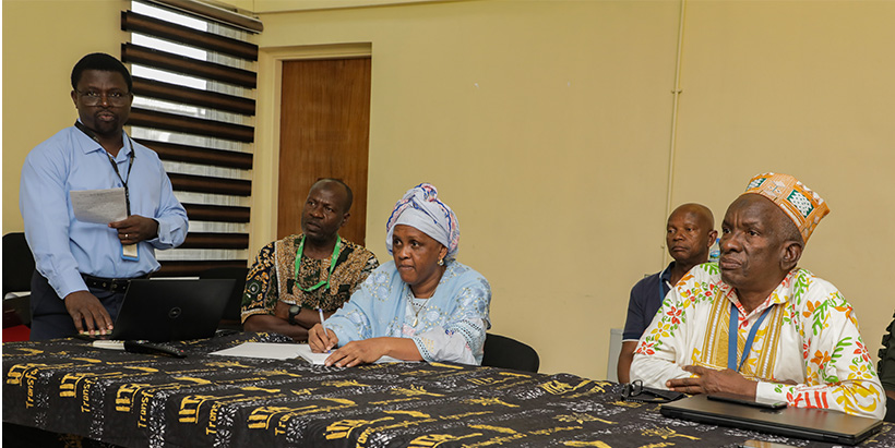  Digital Librarian Soji Oloyede sharing with Mrs Barry the ways Communication Office support researchers and IITA in general.