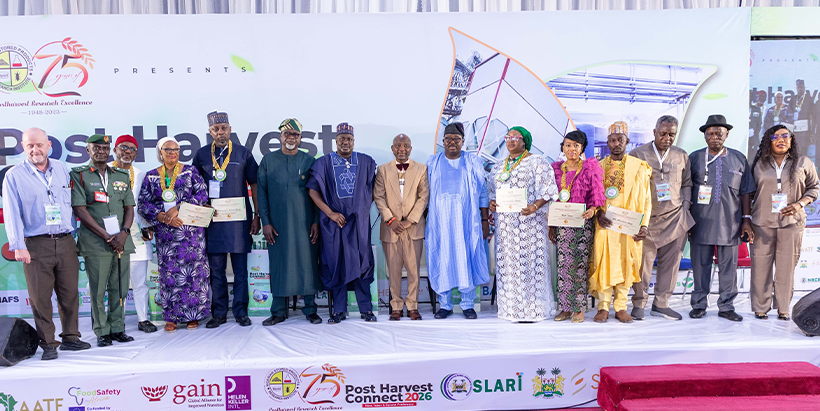Dignitaries on stage at Post-Harvest Connect 2026. Partners including IITA, GAIN, Helen Keller International, Sasakawa, Sahel Consulting, SLARI, and the World Bank Group were represented at the landmark event.