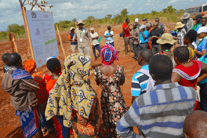 Dr Fidelis Myaka, Project Manager for the Building capacity for Resilient Food Security project explaining the CSA practices selected and being demonstrated at the demonstration plot at Kilimbili village, Morogoro.