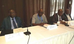Picture of Dr Nzola Mahungu, Country Representative of IITA-DRC; Ir Augustin Kadima, delegate of USAID; Evariste Bushabu, General Secretary of the Ministry of Agriculture; Clement Kandu, Coordinator of SENASEM, at the workshop on CBSD.