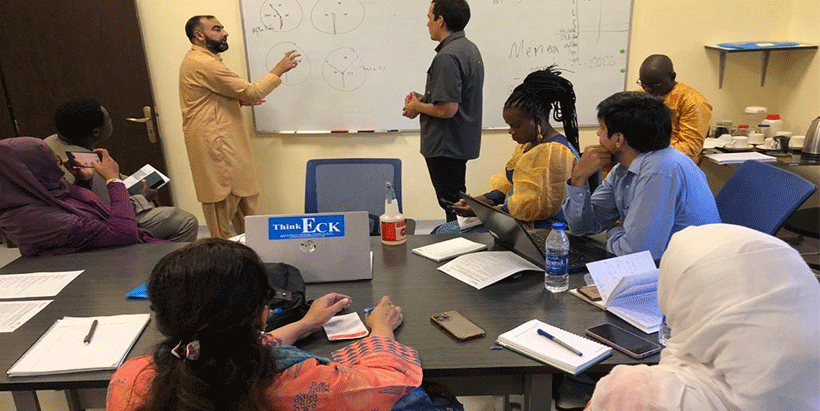  Dr. Atif Jamal and Alejandro Ortega-Beltran discussing tracking of active ingredient biocontrol isolates using vegetative compatibility assays.