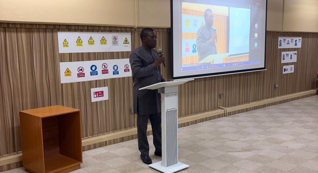 The Project Lead delivering a comprehensive recap of the project journey from inception to date and goodwill message.