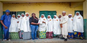  A group of 10 women in Adamawa's Diary Industry receiving a cooperative certificate.