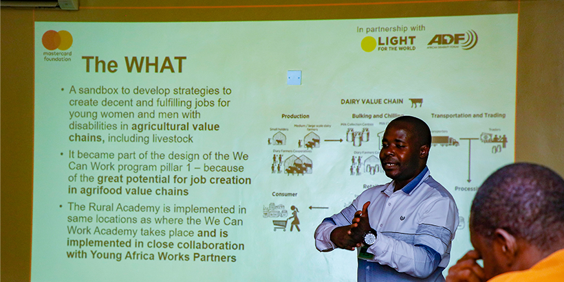 Eric Mukabi delivering a presentation to the Youth in Agribusiness team.