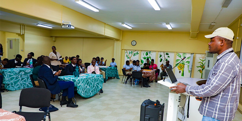 Field Supervisor, Ademola Ajayi discussing birds and water for sustaining bird life with invited students.