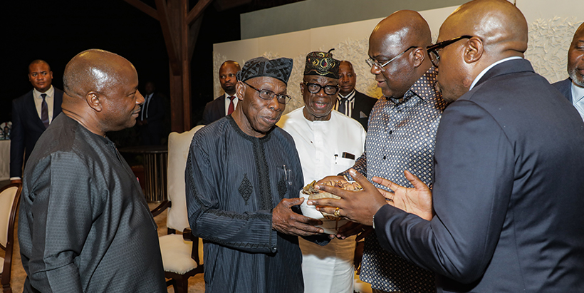 Former President Olusegun Obasanjo presenting a gift to DRC President Feliz Tshisekedi.
