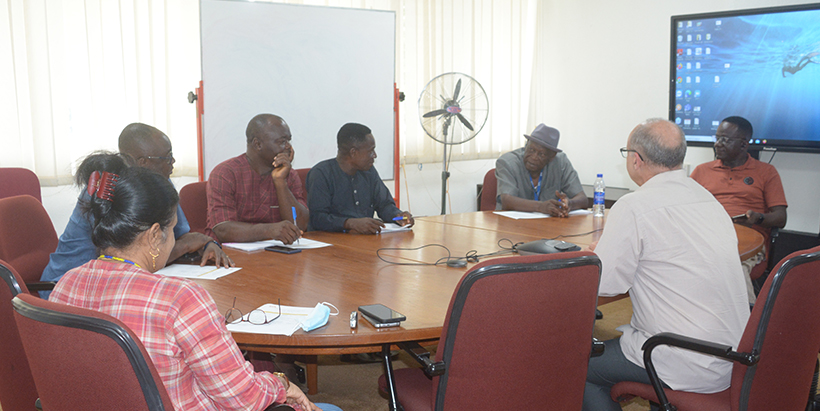 Hallelluya Farm Estate team discussing the purpose of the visit with the IITA team.
