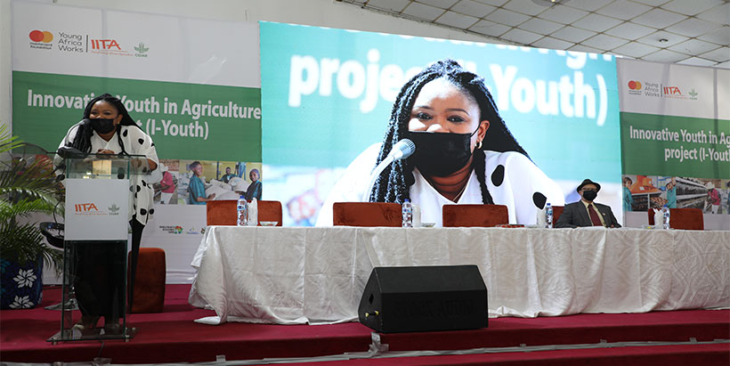 -Youth Executive Manager Aline Mugisho addressing participants at the conference.