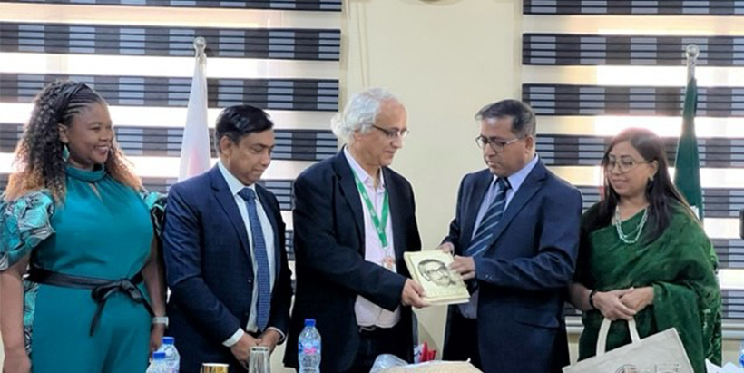 IAA Chief of Party Prakash Kant Silwal (second from right, in black suit) discussing plant health, aflatoxin, and Aflasafe with officials from India and Suriname.