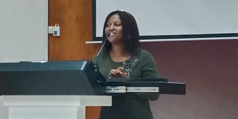IARSAF President Faith Olayiwola giving her remarks at the symposium.