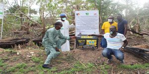 Members of the UGILE cooperative with water pump for the water supply system