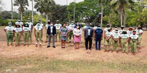 Corp members with (L-R) the Local Government Inspector, Head of IITA CDO, State Coordinator, Zonal inspector, BDO for IYA
