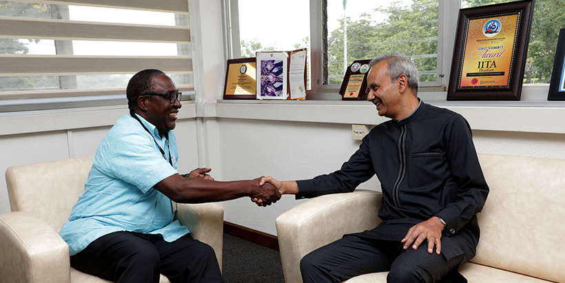 IITA Director General Dr Ehui welcomes Dr Chaudhuri to the institute's headquarters.