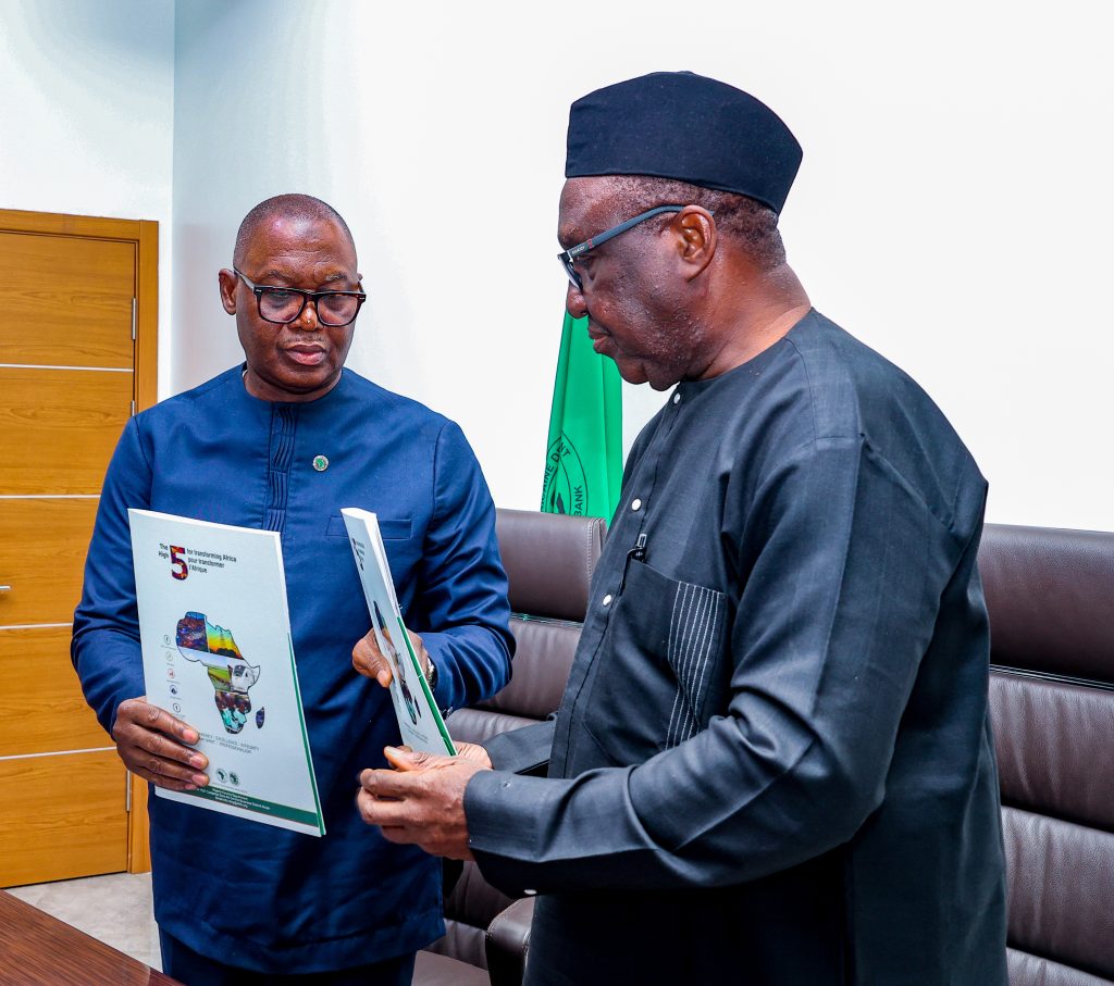 IITA Director General, Dr Simeon Ehui and AfDB Director General for Nigeria, Dr Abdul Kamara exchanging the grant agreement during the signing ceremony at the AfDB headquarters in Abuja.