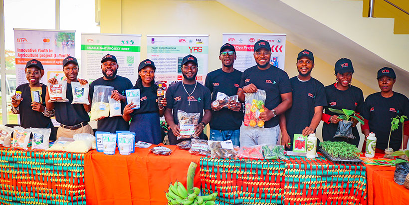 A group photograph of some beneficiaries supported by the IITA Youth Agripreneurs projects with their products.
