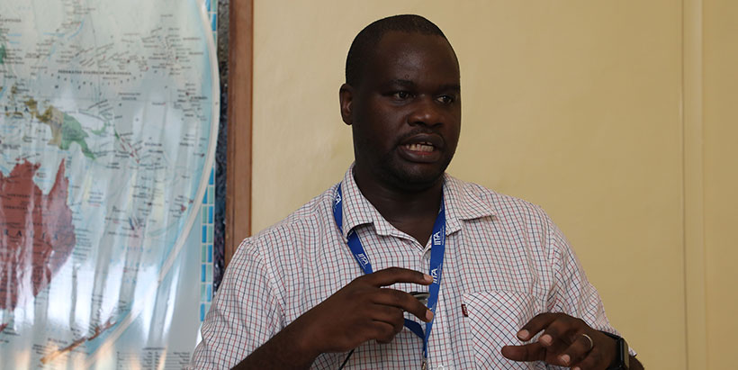 IITA Product Manager for Grain Crops, Dean Muungani, anchoring the meeting.