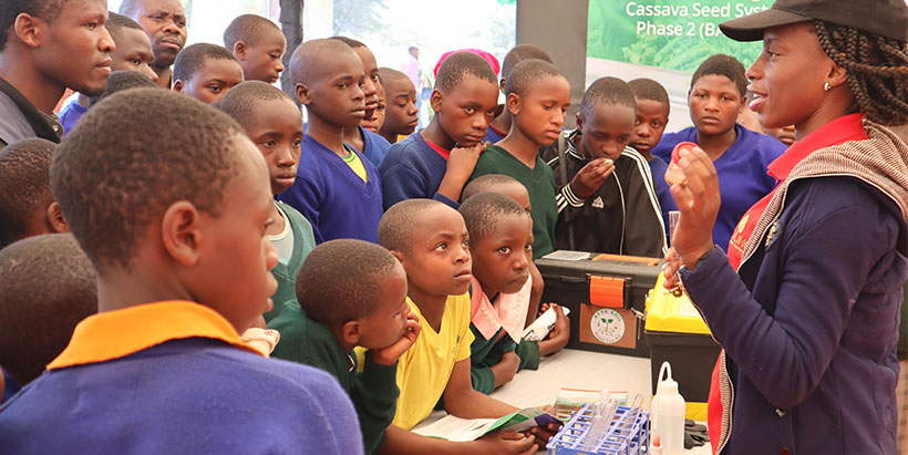 IITA Lab technician showcasing the Afya Soil Rapid test kit functions to students. Photo: IITA/G Ndibalema