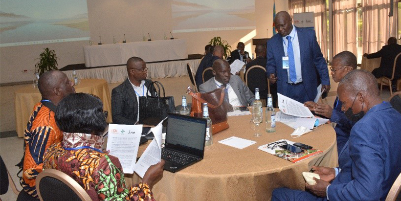 Workshop delegates discussing project implementation plans.