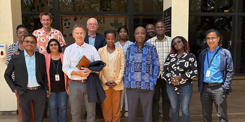 IITA, CIMMYT, and ICRISAT representatives pose for a photo with the NNF Board Vice Chair and his team.