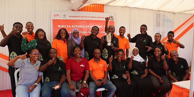  IITA team after receiving a trophy for being the best overall booth at the 2023 Innovation Week. Photo: IITA/Lembris Laizer