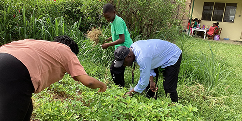 Joshua with his mentor and father in the garden.