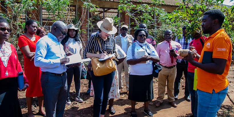 Manduwa (R) briefing the visitors on research activities at IITA.