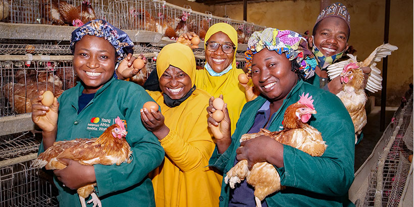 Mariam Abass and her colleagues at their 2,000 bird capacity poultry.