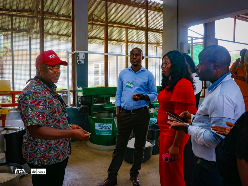 Members of the delegation during a guided tour of the cassava processing section of the IITA Cassava Breeding Unit.