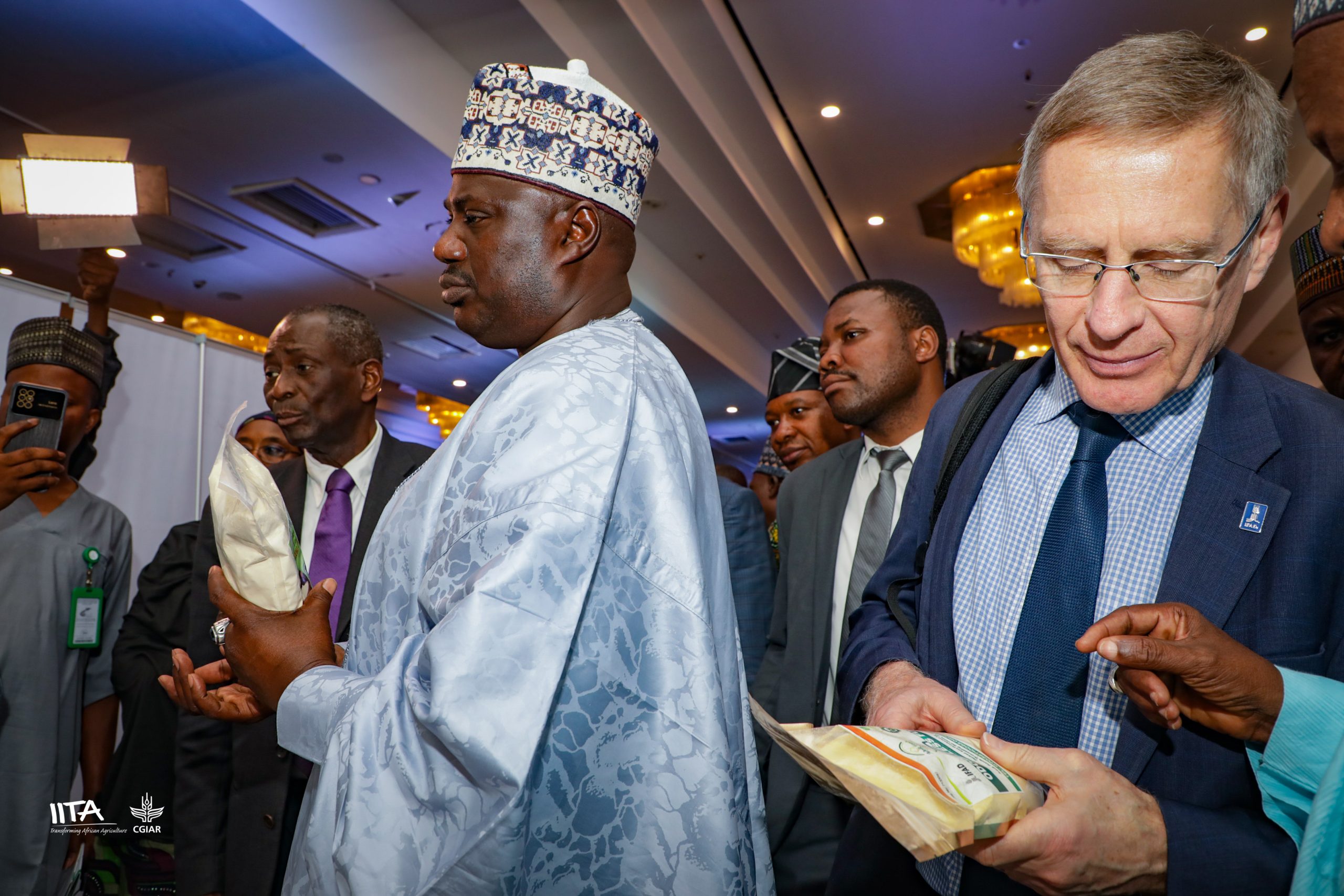 Minister of State for Agriculture, Sen. Aliyu Sabi Abdullahi and IFAD Vice President Dr Donal Brown examining products.